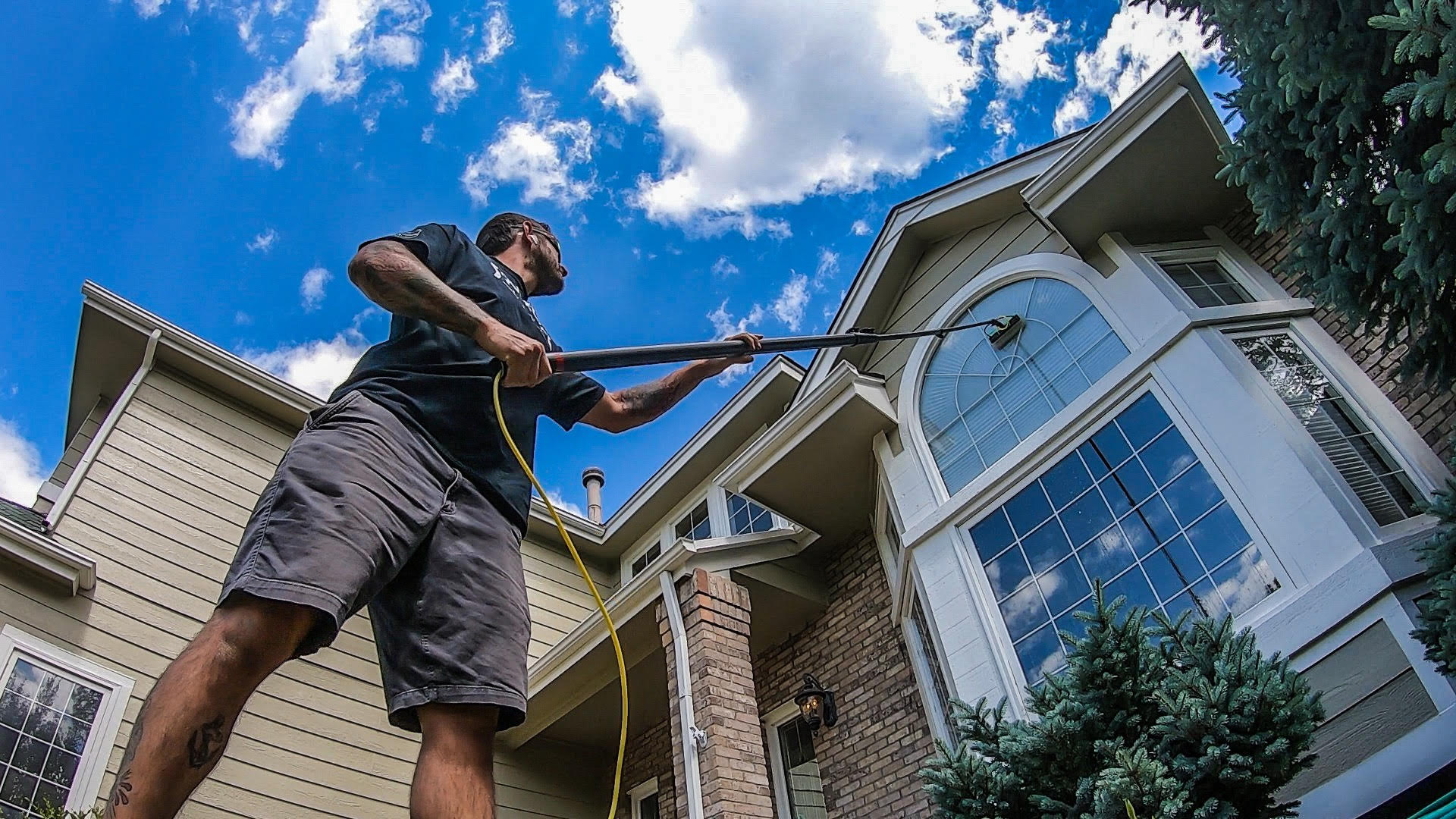 Window cleaning with a long pole in the source photograph