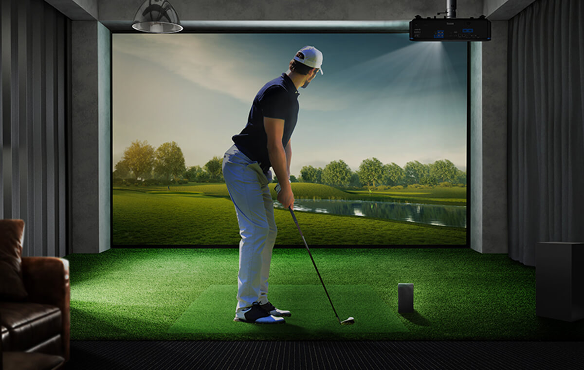 Golfer facing an indoor simulator display in the source photograph