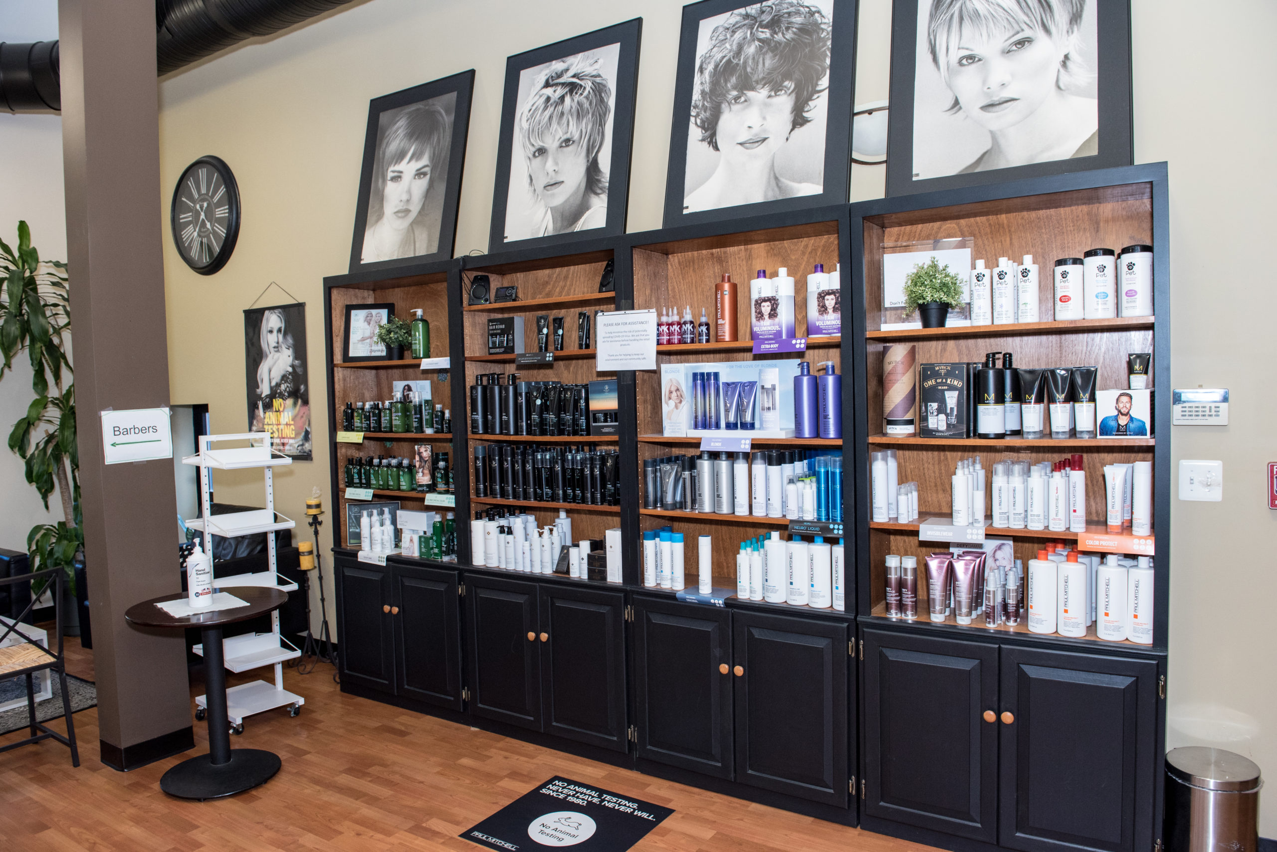 A salon interior with a chair and product shelves