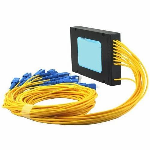 An optical component housing with yellow fibre leads and blue connectors