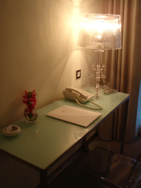 A desk and chair in a hotel room